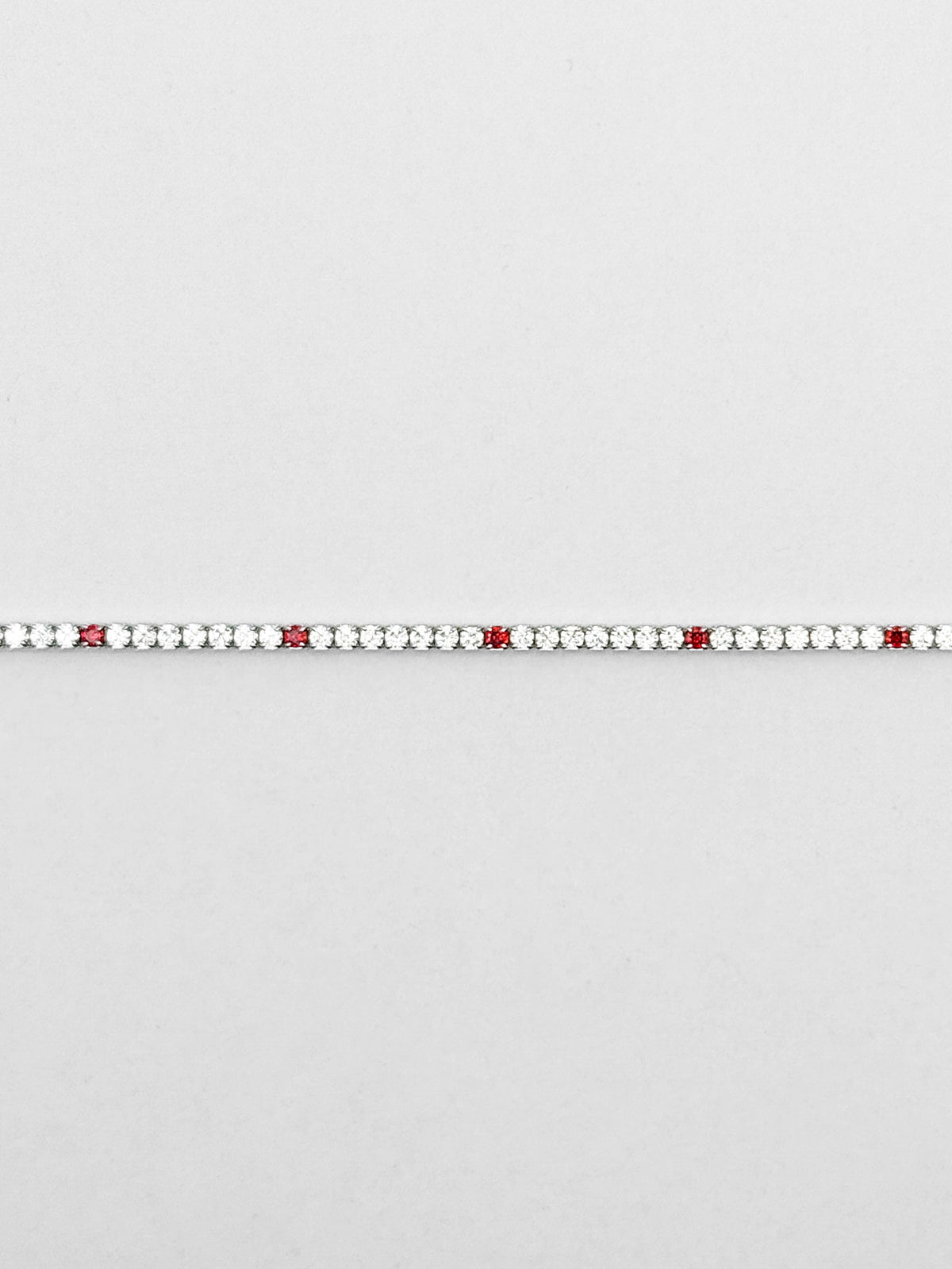Bracciale tennis 2 mm in argento con zirconi rosso-arancio