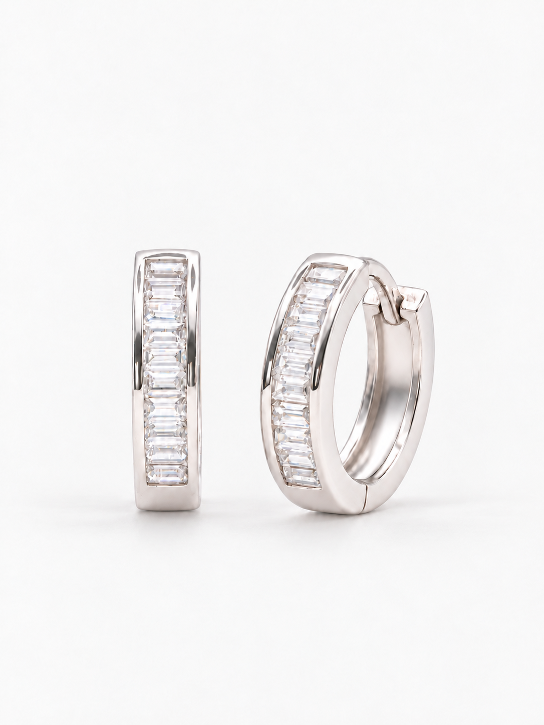 Rhodium-plated 925 sterling silver hoop earrings with a row of baguette-cut cubic zirconia