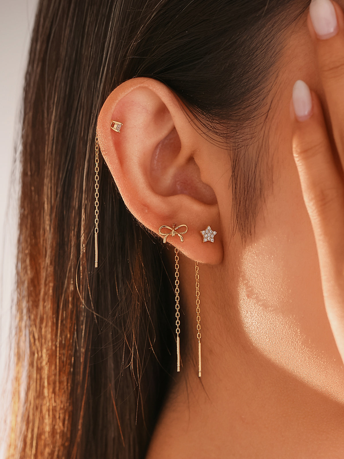 set di orecchini saliscendi in argento, a forma di fiocco, stella