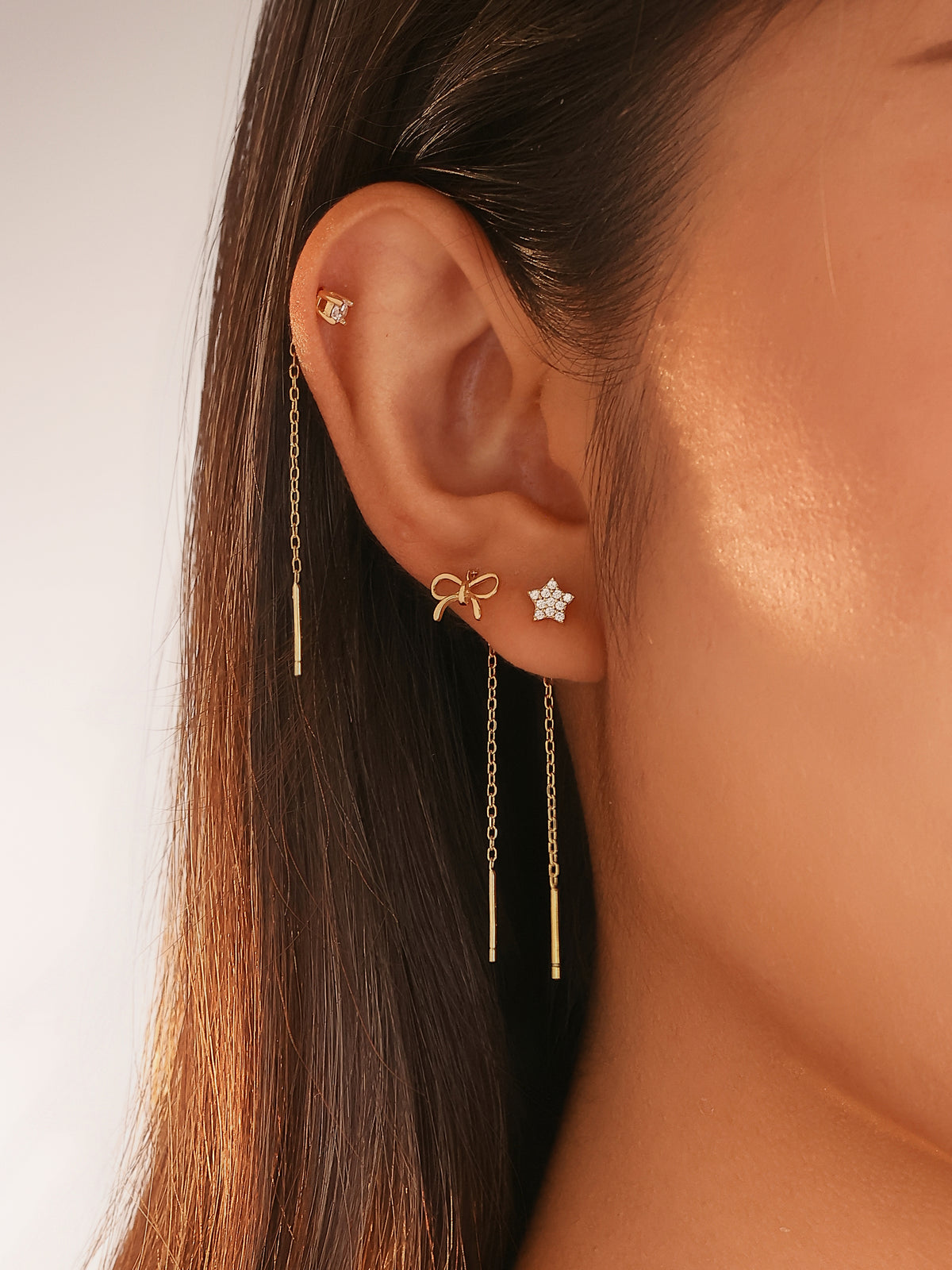 set di orecchini saliscendi in argento, a forma di fiocco, stella